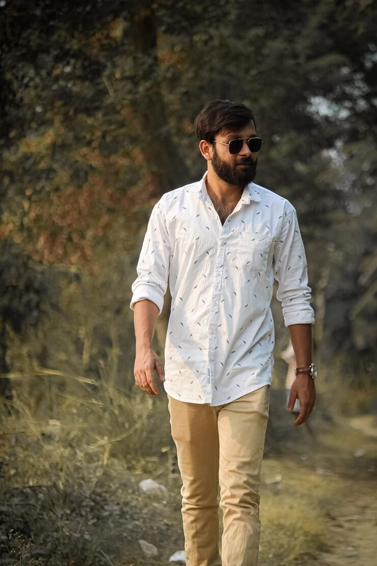 young-man-looking-away-while-standing-land_1048944-16620346